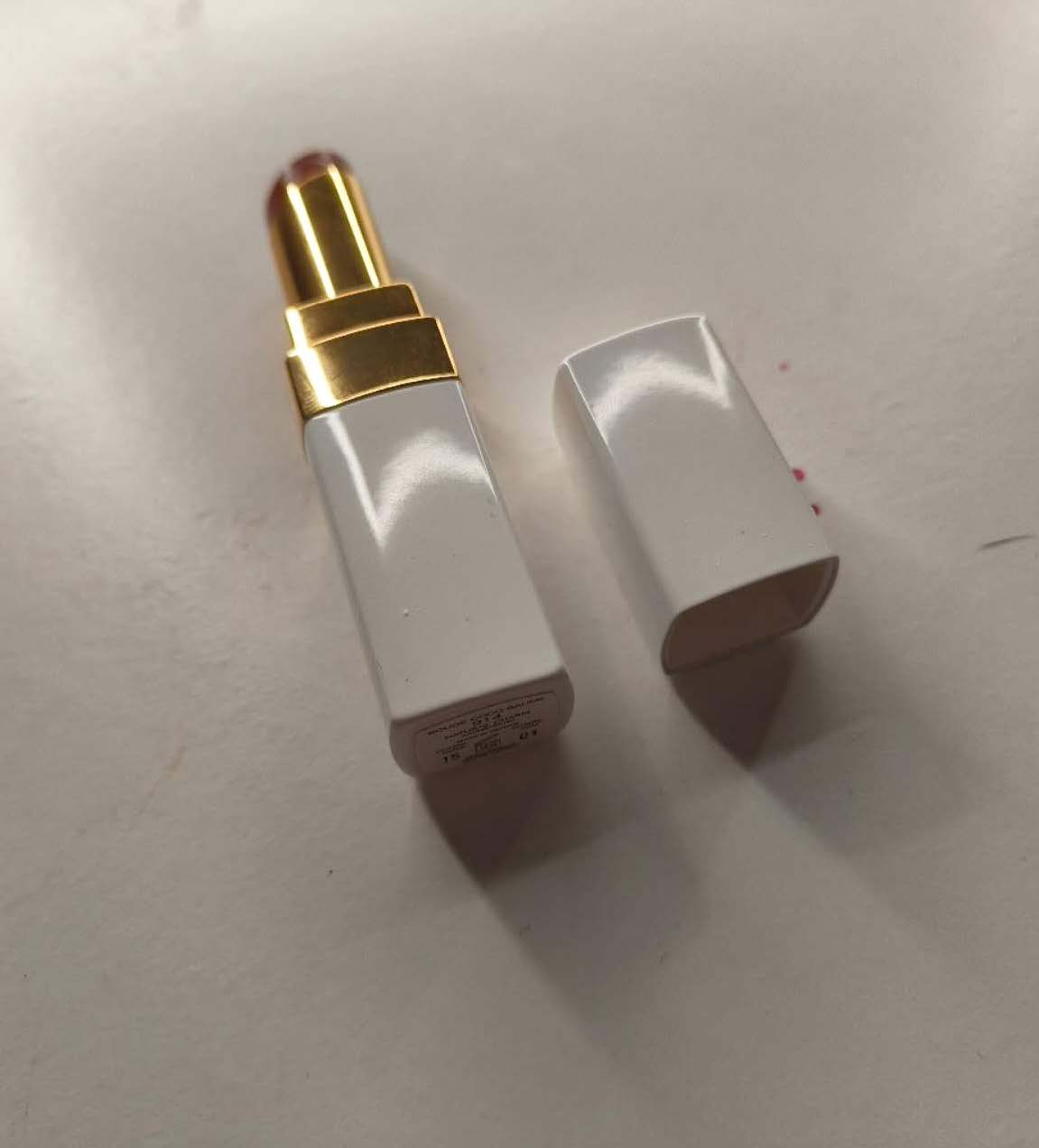 This is a side-bottom view photo of a lipstick